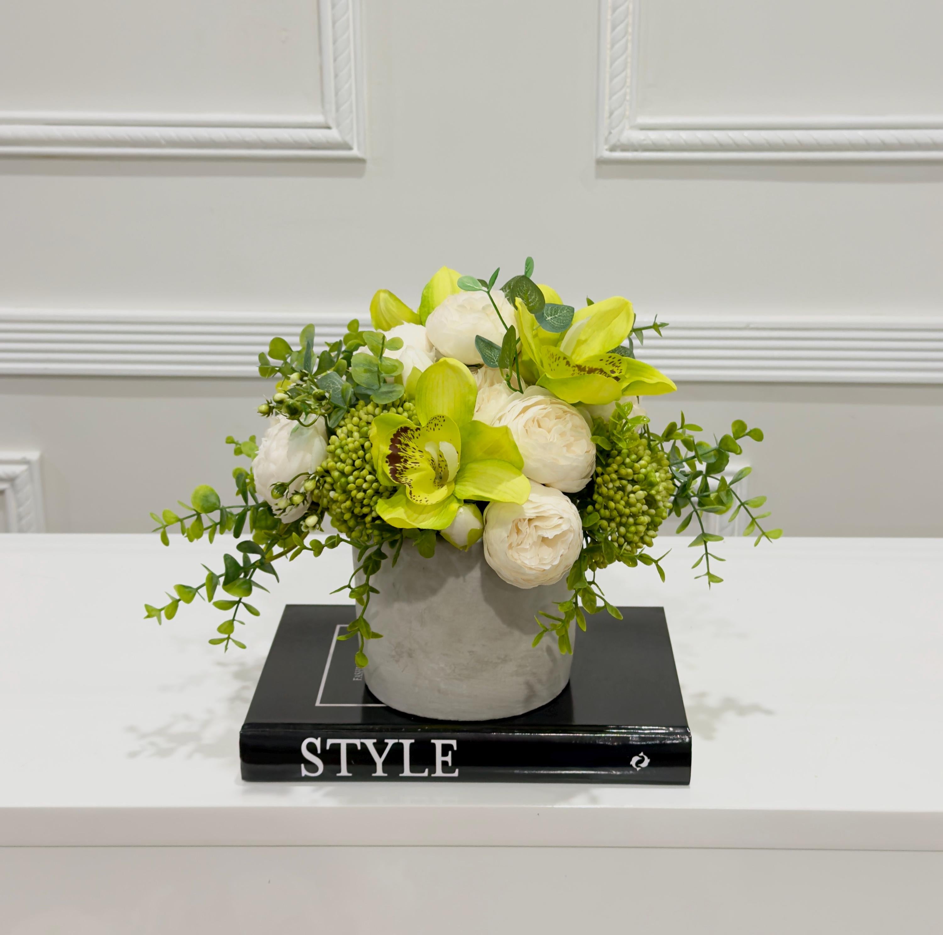 Real touch green orchid and ivory peony arrangement side view