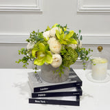 Green orchid peony centerpiece with faux water close-up view
