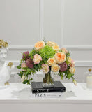 Peach rose lisianthus hydrangea centerpiece on console table