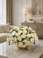 Ombre peony centerpiece in gold vase styled on a console