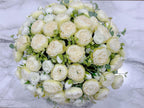 Overhead view of white green ombre peony centerpiece