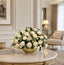 White peony faux floral centerpiece in gold vase styled on a French country console