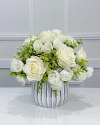 White silk rose and peony faux floral centerpiece in a ribbed vase