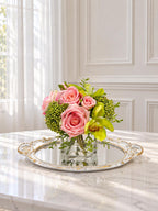 Pink and green real touch rose and orchid faux floral centerpiece in a glass vase