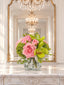 Pink and green real touch rose and orchid faux floral centerpiece in a glass vase