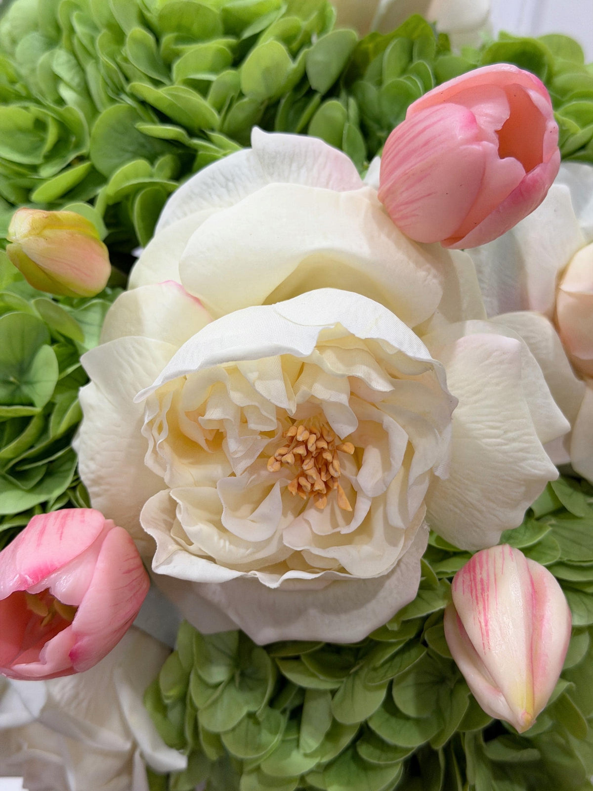 Real touch rose hydrangea tulip centerpiece in a gold vase
