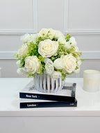White silk rose and peony faux floral centerpiece in a ribbed vase