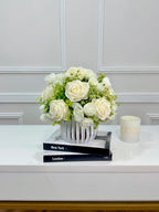 White silk rose and peony faux floral centerpiece in a ribbed vase
