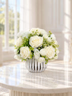 White silk rose and peony faux floral centerpiece in a ribbed vase