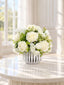 White silk rose and peony faux floral centerpiece in a ribbed vase
