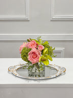 Pink and green real touch rose and orchid faux floral centerpiece in a glass vase