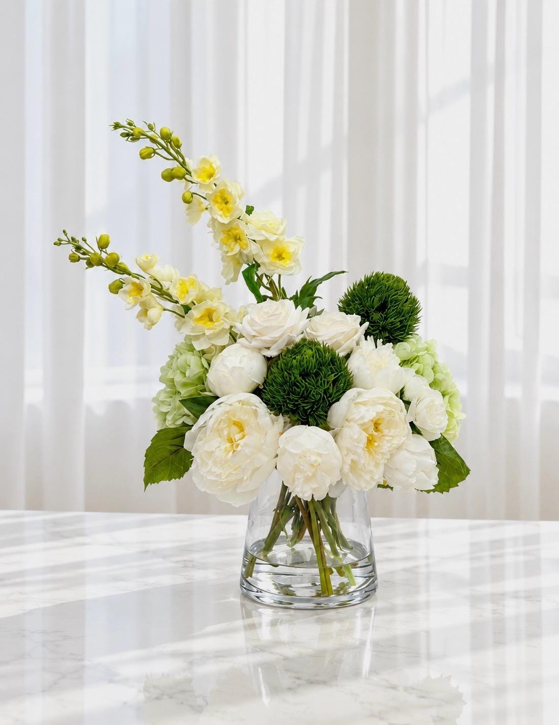 Real touch hydrangea and rose arrangement with silk peonies in a glass vase