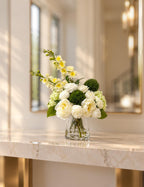 Detail of green hydrangea green accent balls and white peonies in the arrangement
