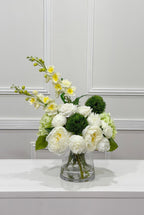Side view of white peony rose and green hydrangea artificial flower centerpiece
