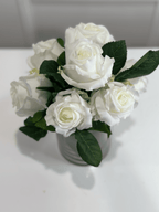 Cream rose bouquet in glass vase