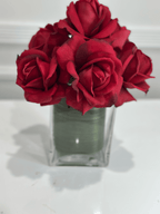 Burgundy rose arrangement in glass vase