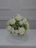 White silk rose and peony faux floral centerpiece in a ribbed vase