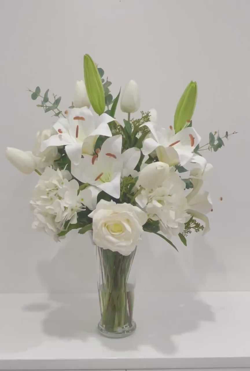Large Elegant White Lilies Centerpiece In Tall Glass Vase