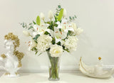 Large Elegant White Lilies Centerpiece In Tall Glass Vase